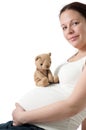 Pregnant woman with teddy bear Royalty Free Stock Photo