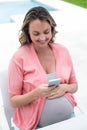 Pregnant woman texting Royalty Free Stock Photo