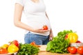 Pregnant woman with tomato Royalty Free Stock Photo