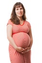 Pregnant woman touching or bonding her abdomen