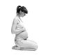 Pregnant woman touching her belly with hands isolated on white Royalty Free Stock Photo