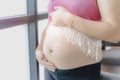 Pregnant woman touching her belly with hands Royalty Free Stock Photo