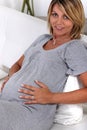 Pregnant woman touching her stomach