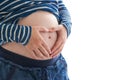 Pregnant woman touching and rubbing her belly Royalty Free Stock Photo