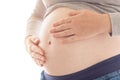 Pregnant woman touching and rubbing her belly Royalty Free Stock Photo