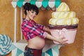 Pregnant woman with toy cake Royalty Free Stock Photo