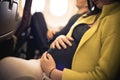 Pregnant woman traveling with airplane. Close up. Royalty Free Stock Photo