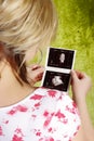 Pregnant woman with a ultrasound image Royalty Free Stock Photo