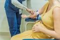 pregnant woman undergoes a blood test, a pivotal step in ensuring the well-being of both herself and her developing baby Royalty Free Stock Photo