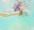 Pregnant woman underwater swimming in tropical sea. Healthy and active pregnancy. Young expecting mom on summer beach Royalty Free Stock Photo