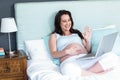 Pregnant woman using laptop Royalty Free Stock Photo