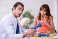 Pregnant woman visiting male doctor gynecologist Royalty Free Stock Photo