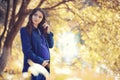 Pregnant woman on a walk in the park Royalty Free Stock Photo