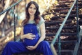 Pregnant woman on a walk in the park Royalty Free Stock Photo