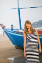 Pregnant woman walking along a beach Royalty Free Stock Photo