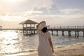 Pregnant woman walking on the beach at sunset Royalty Free Stock Photo