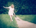 Pregnant woman walking in the park barefoot walking on carpet, h Royalty Free Stock Photo