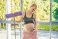 Pregnant woman washes the floor and is tired. Tired pregnant woman having pain in back while she is cleaning her house Royalty Free Stock Photo