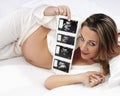 Pregnant woman watching ultrasound picture