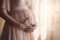 Pregnant woman wearing beautiful dress holding her hands on belly on a light background. Pregnancy, maternity, preparation and