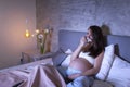 Pregnant woman crying while watching sad movie Royalty Free Stock Photo