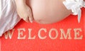 Pregnant woman on the wellcome-carpet Royalty Free Stock Photo