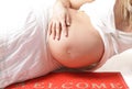 Pregnant woman on the wellcome-carpet