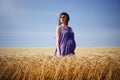 Pregnant woman in wheat field