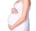 Pregnant woman in a white dress
