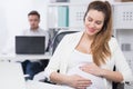 Pregnant woman at work Royalty Free Stock Photo