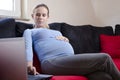 Pregnant woman working from home Royalty Free Stock Photo