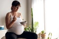 Pegnant woman eating some healthy food