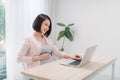 Pregnant woman working on laptop at home Royalty Free Stock Photo