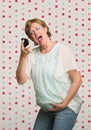 Pregnant Woman Yelling at Phone Royalty Free Stock Photo