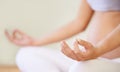 Pregnant woman, yoga meditation and hands in studio with relax wellness and mindfulness for prenatal care. Young person Royalty Free Stock Photo