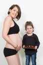 Pregnant woman enjoying of eating chocolate and strawberry at home Royalty Free Stock Photo