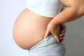 Pregnant women with low back pain on white background,Health con Royalty Free Stock Photo