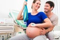 Pregnant woman and man in delivery room of hospital