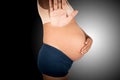 Pregnant women show hand stop on gray background Royalty Free Stock Photo