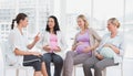 Pregnant women talking together at antenatal class Royalty Free Stock Photo