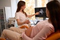 Pregnant woman undergoing ultrasound test Royalty Free Stock Photo