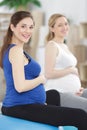 Pregnant woman in yoga class Royalty Free Stock Photo