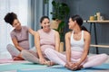 Pregnant, women and yoga on a living room floor for exercise, fitness and health, talking and happy. Friends, pregnancy Royalty Free Stock Photo