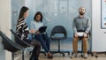 Pregnant worker asking african american woman to join recruitment meeting Royalty Free Stock Photo