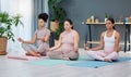 Pregnant, yoga or women in class for meditation, exercise or fitness workout in zen house studio. Pregnancy, peace or Royalty Free Stock Photo