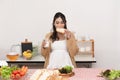 Pregnant Young Asian Woman Cooking vegetables. Healthy Food and drink - Vegetable Salad. Dieting. Dieting Concept. Healthy Royalty Free Stock Photo