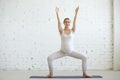 Pregnant young woman doing prenatal yoga. Sumo Squat Pose Royalty Free Stock Photo