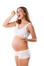 Pregnant young woman eating health food