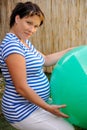 Pregnant young woman exercising with ball Royalty Free Stock Photo