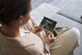 Pregnant young woman holding ultrasound picture of baby enjoying motherhood Royalty Free Stock Photo